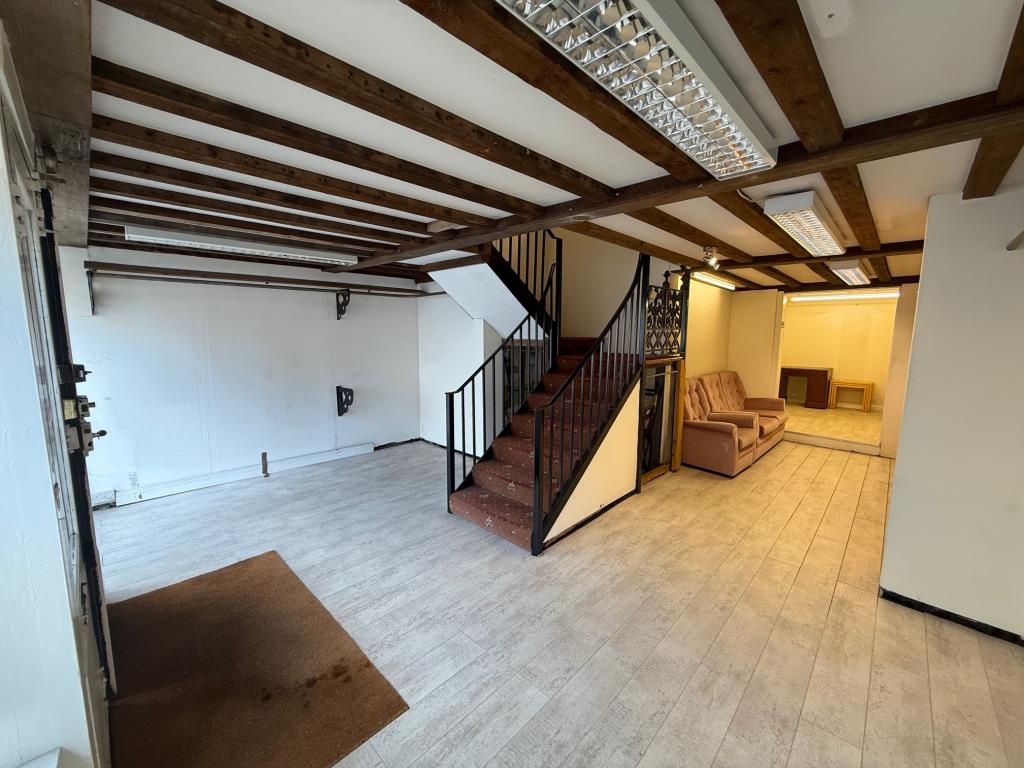 Lot: 28 - VACANT COMMERCIAL PREMISES - RETAIL OR STUDIO UNIT - Shop area from the front right corner and stair to first floor